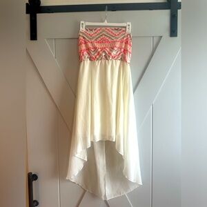 Fun spring/ summer sundress, adorned with coral and gold accents at top. Medium.